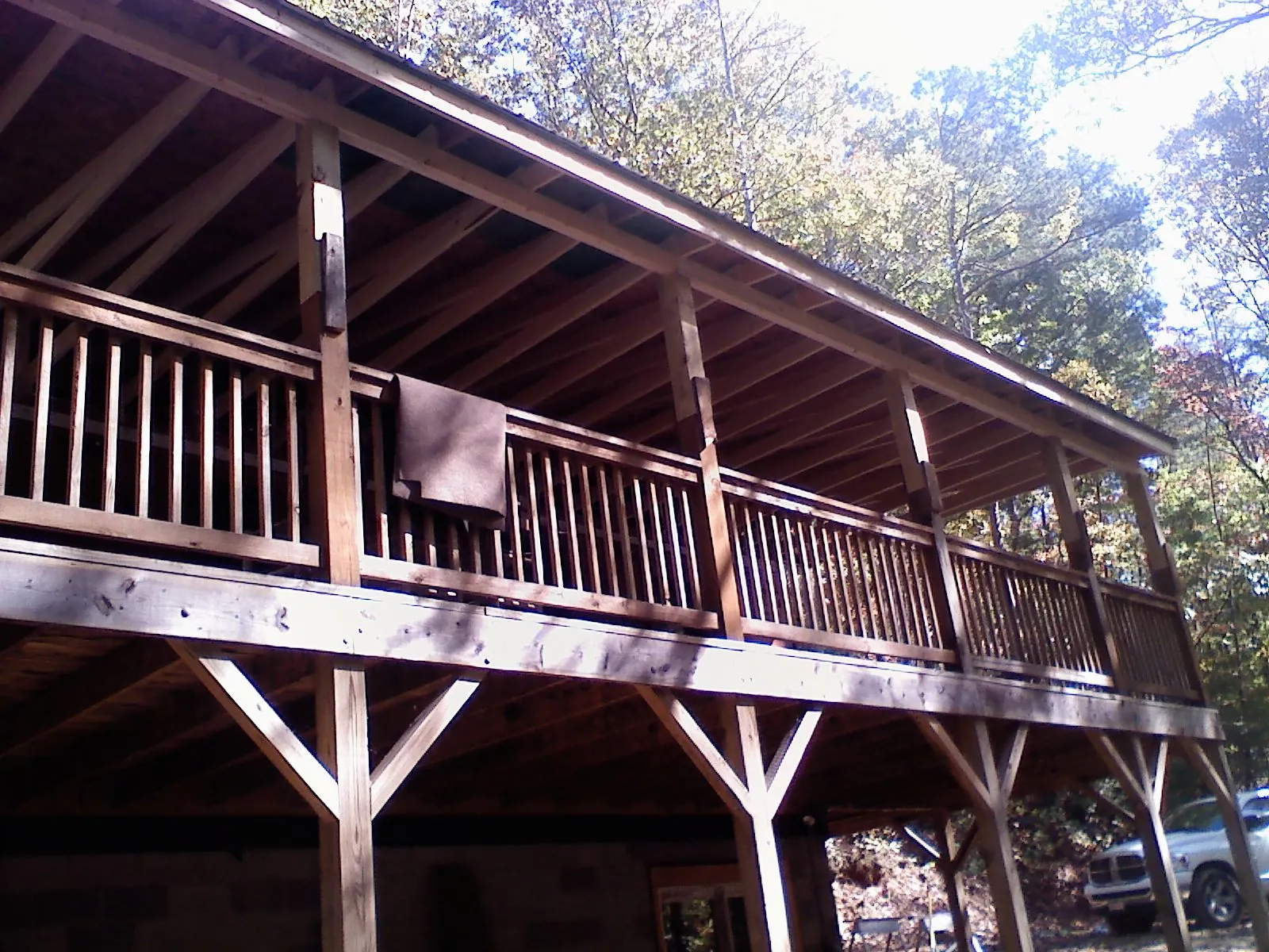 Timber framing under a new elevated porch and deck in Irwin